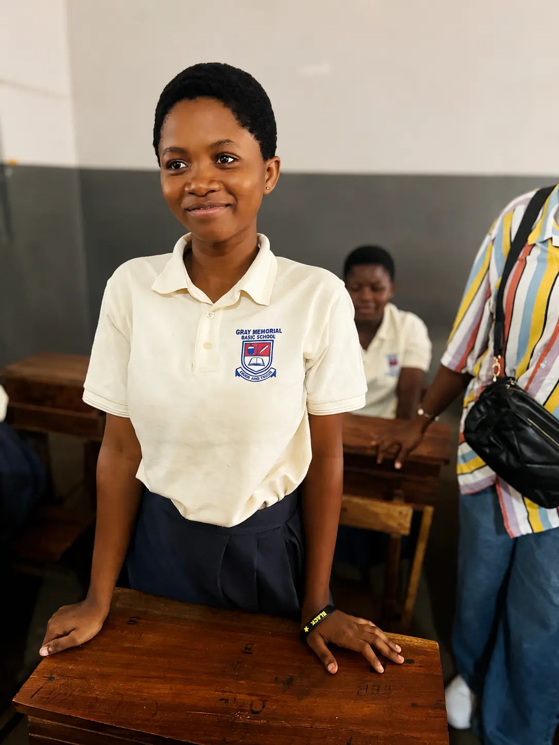 A Gray Memorial Basic School student smiling at her desk