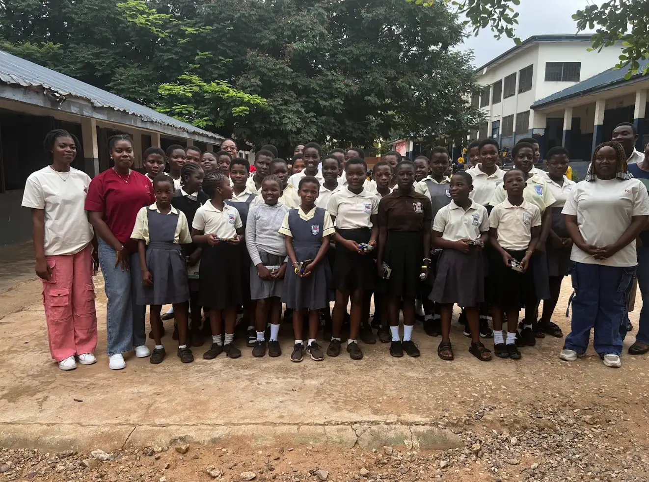 Kelsies Foundation volunteers and students gathered outside the school